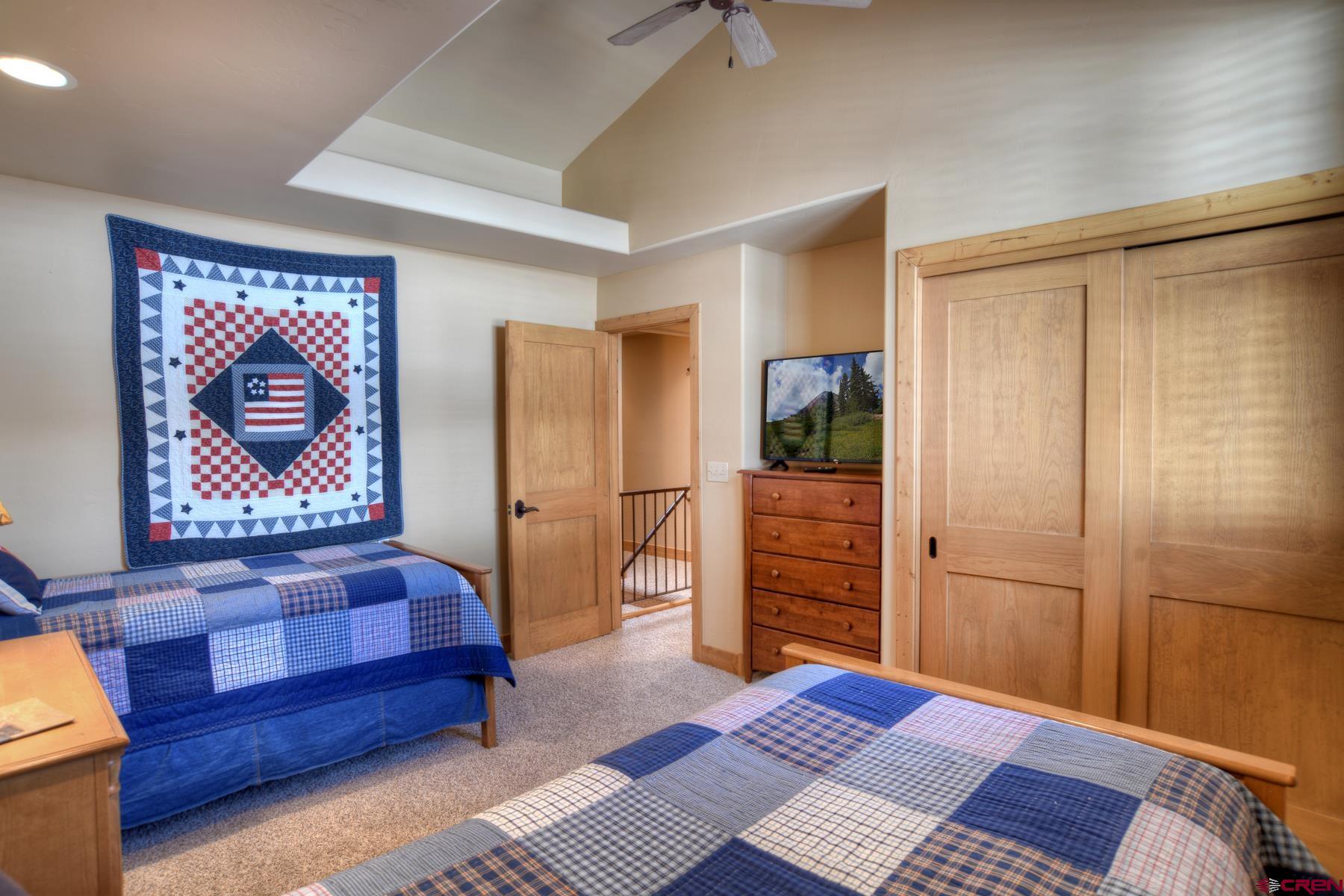 67 Travertine Trail, Unit 67 Durango, CO 81301 - Photo 26 of 35 a bedroom with a bed and furniture