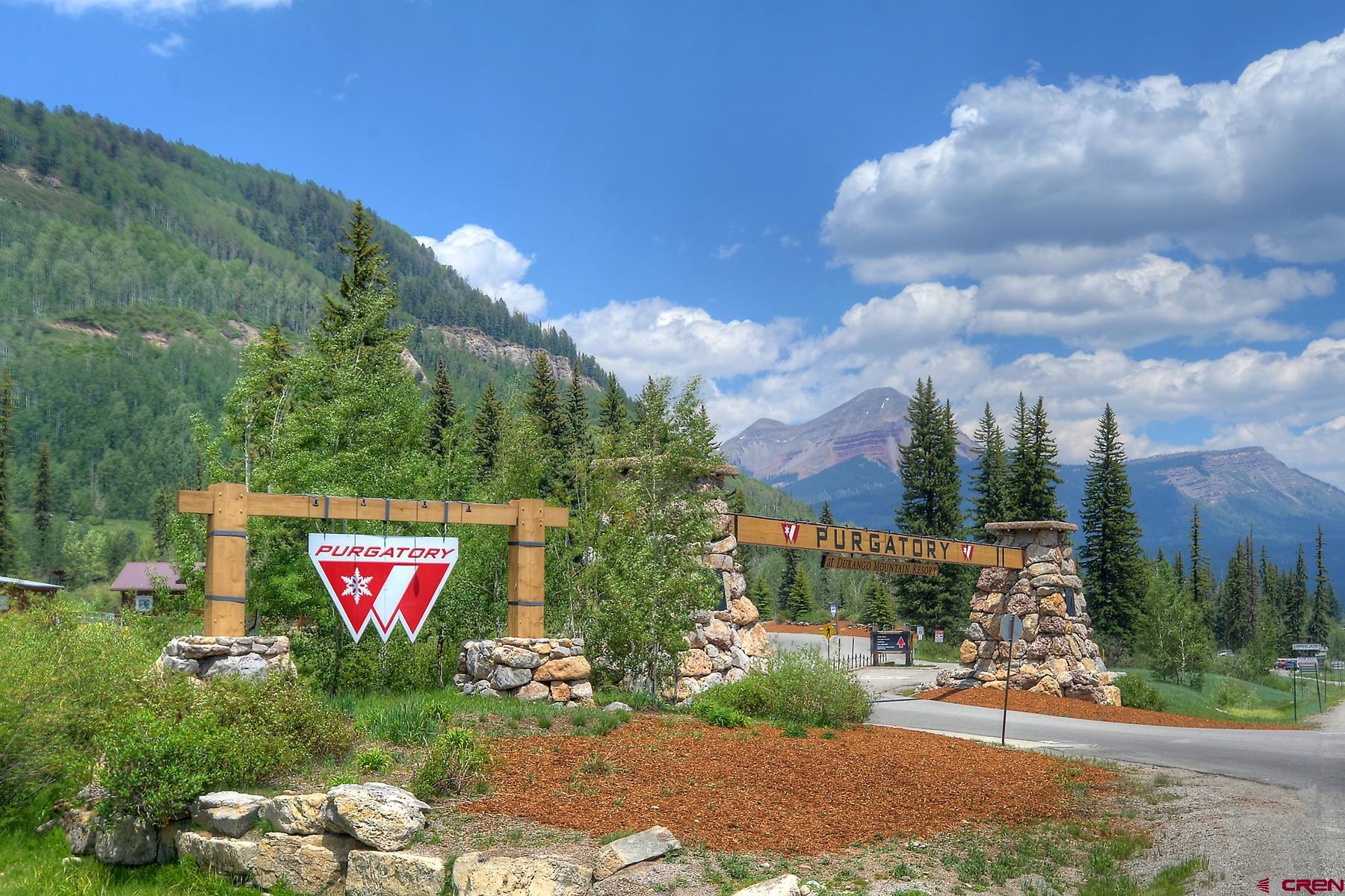 67 Travertine Trail, Unit 67 Durango, CO 81301 - Photo 31 of 35 a sign that is sitting in front of a building