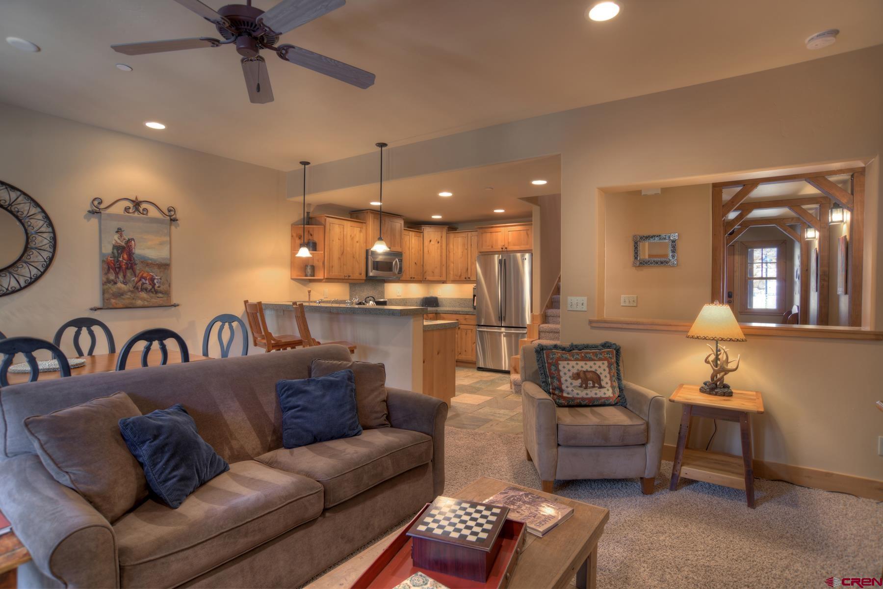 67 Travertine Trail, Unit 67 Durango, CO 81301 - Photo 8 of 35 a view of a livingroom with furniture and a ceiling fan