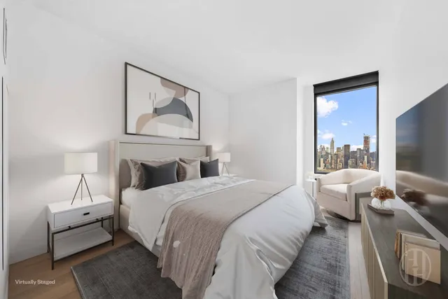 a bathroom with a toilet a sink a mirror and vanity