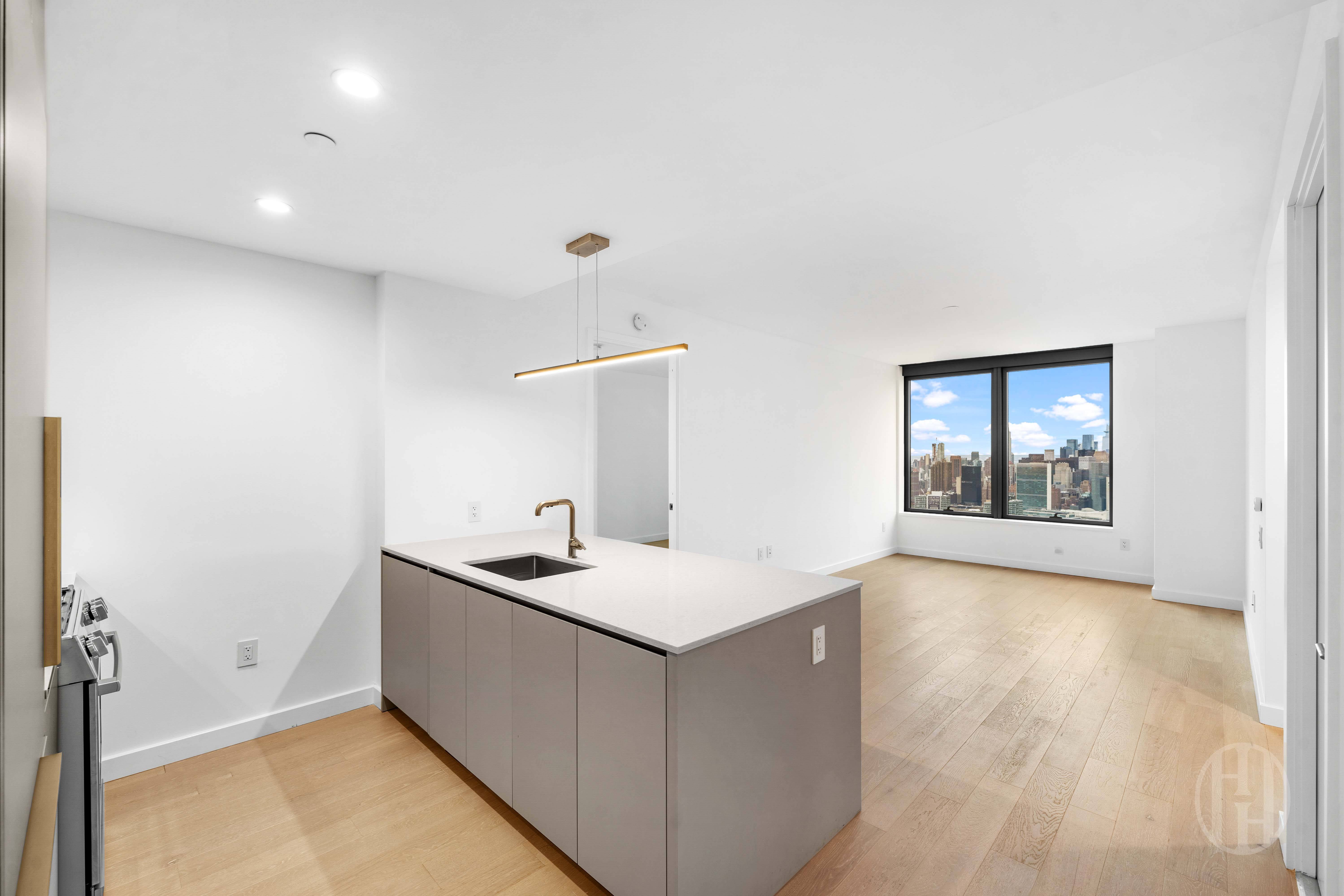 3 Court Square, Unit 5601 Queens, NY 11101 - Photo 2 of 20 a bathroom with a sink and a mirror