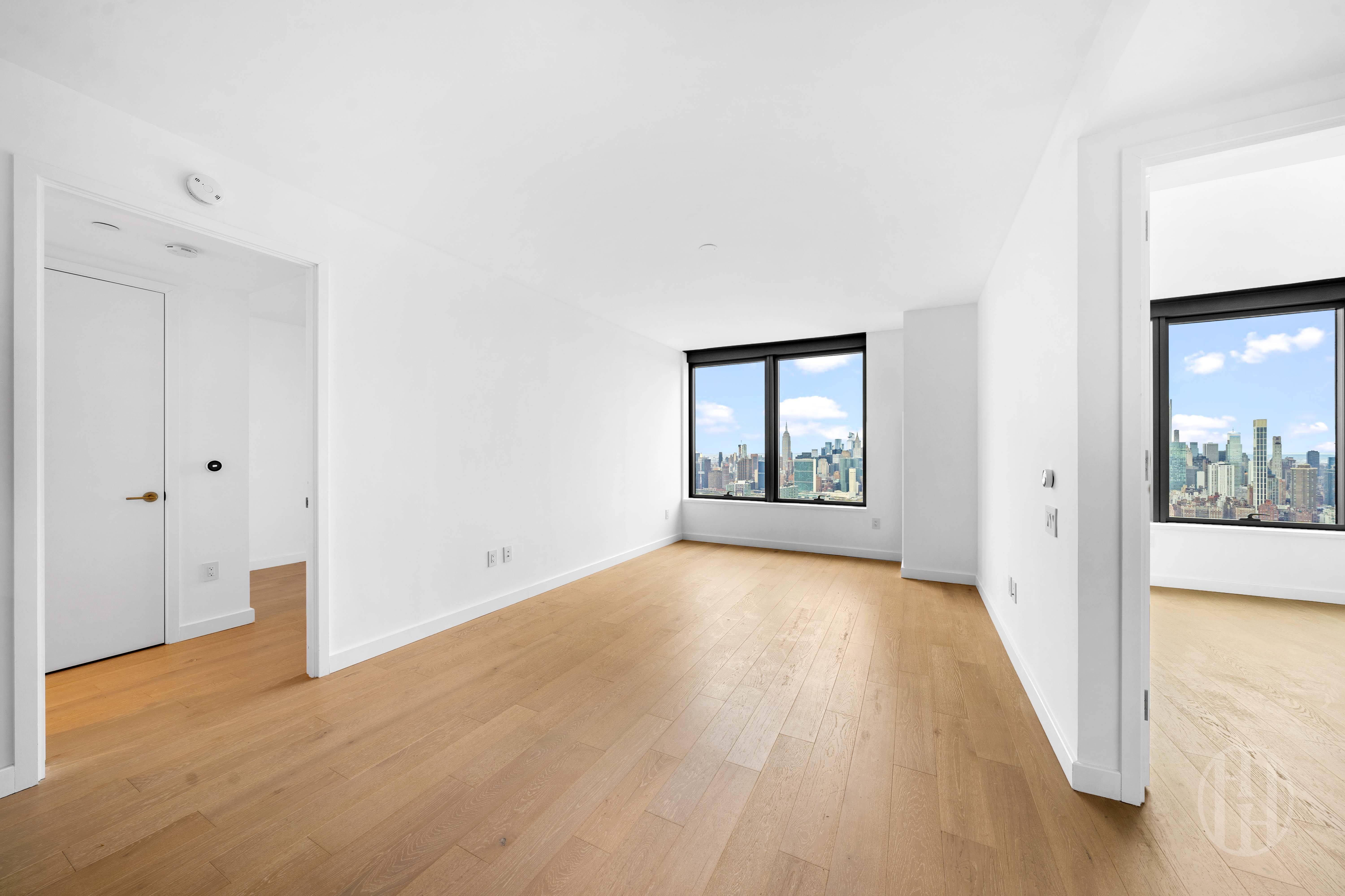 3 Court Square, Unit 5601 Queens, NY 11101 - Photo 4 of 20 a view of a hallway with wooden floor and a living room