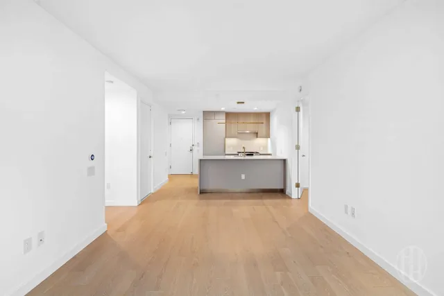 a kitchen with stainless steel appliances a sink and a refrigerator