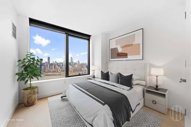a view of a kitchen with a sink and a refrigerator