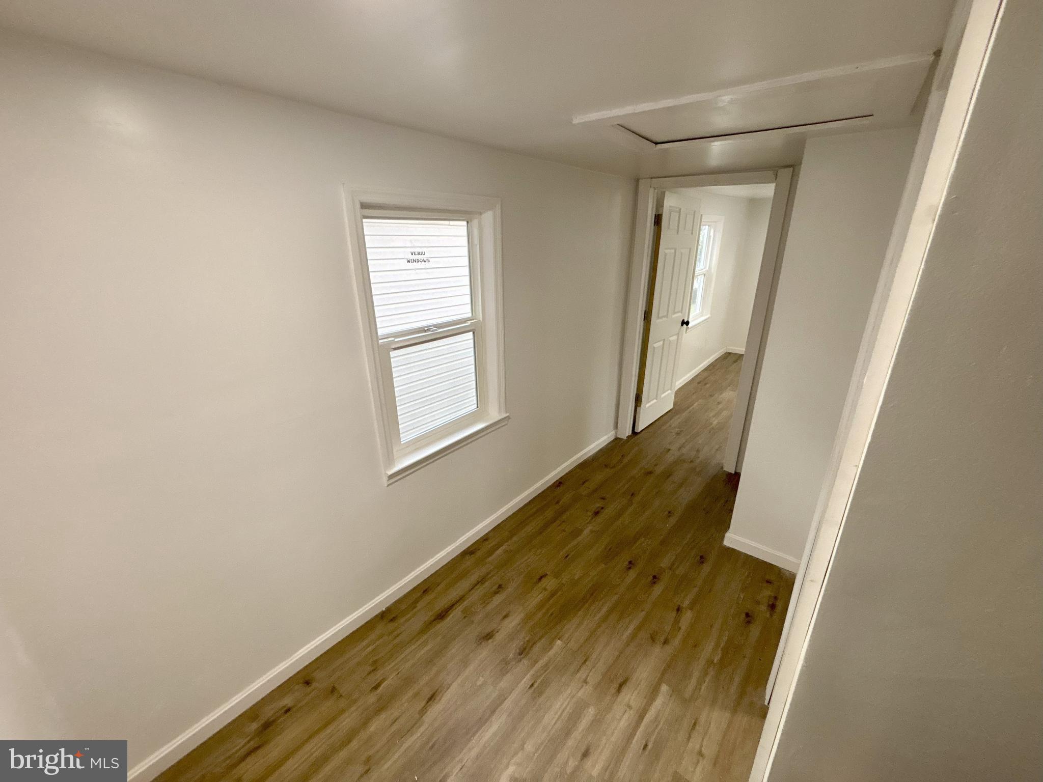 802 Fairmount Avenue Cambridge, MD 21613 - Photo 12 of 16 a view of an entryway with wooden floor