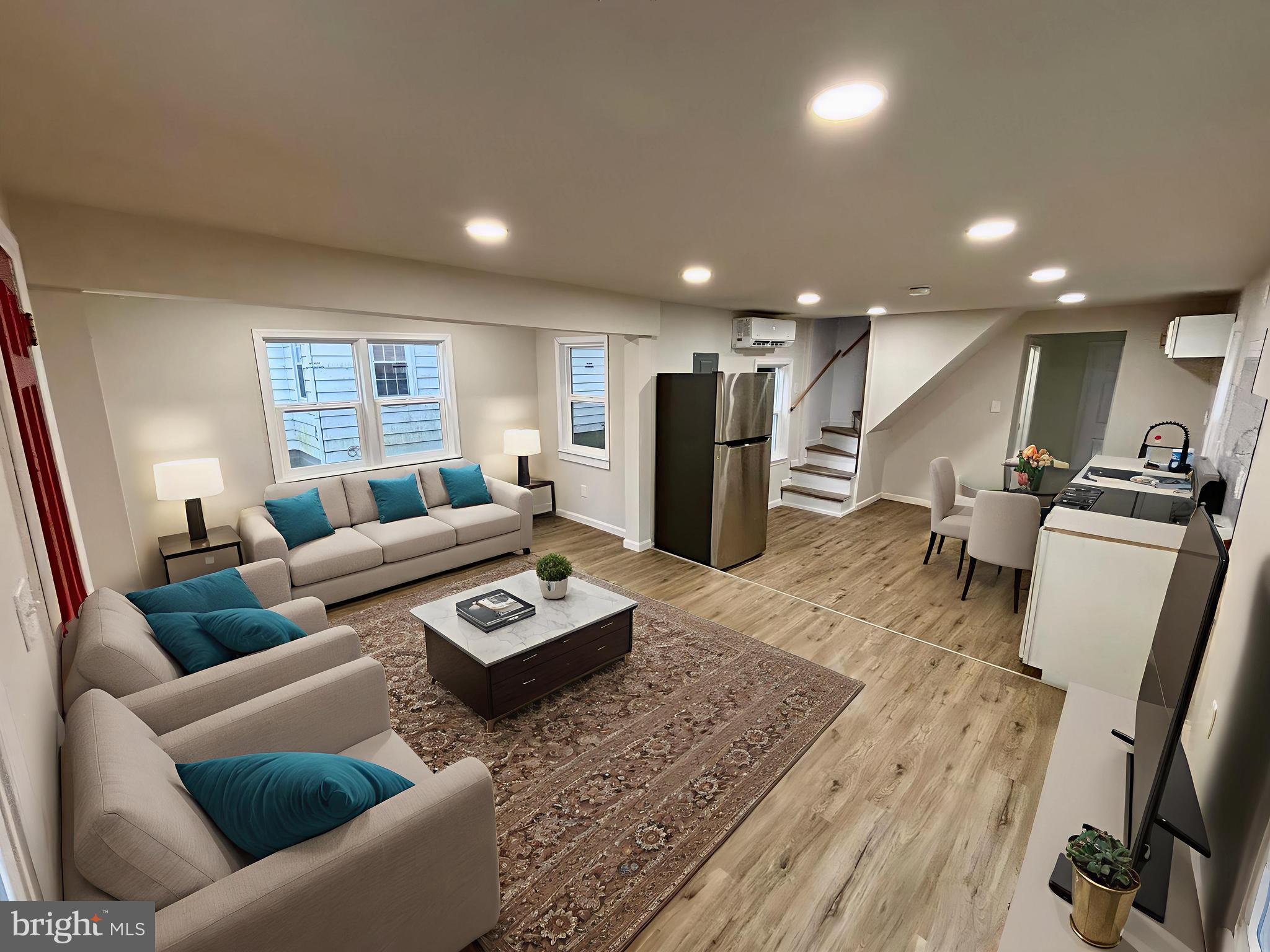 802 Fairmount Avenue Cambridge, MD 21613 - Photo 14 of 16 a living room with furniture and a wooden floor