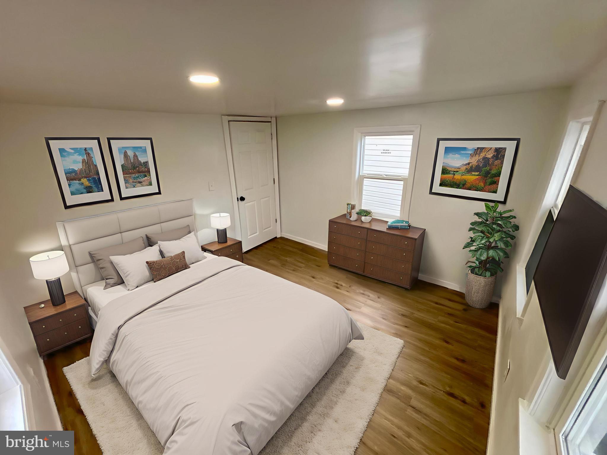 802 Fairmount Avenue Cambridge, MD 21613 - Photo 15 of 16 a bedroom with bed and a couch