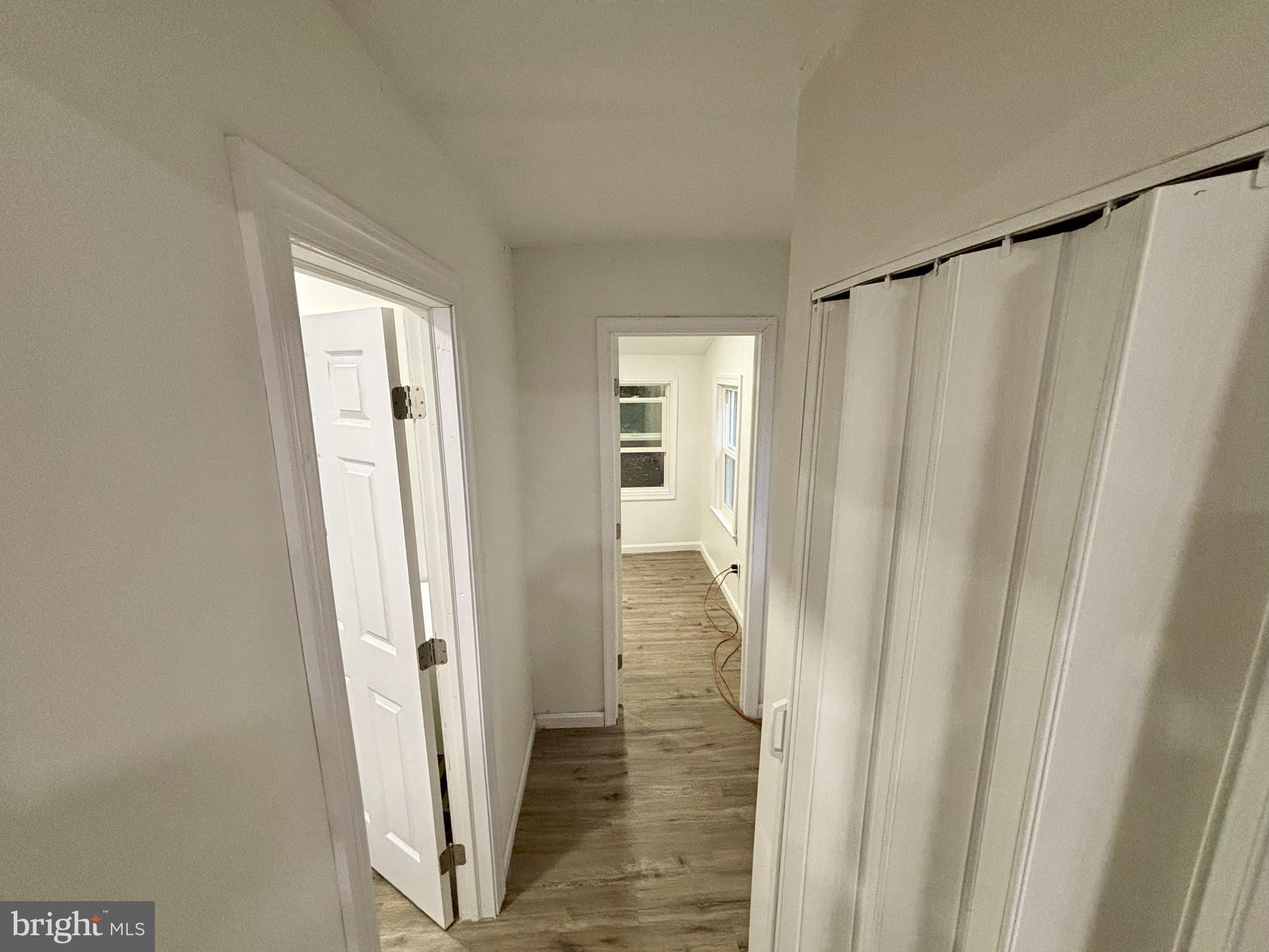 802 Fairmount Avenue Cambridge, MD 21613 - Photo 6 of 16 a view of a hallway with wooden floor and entryway