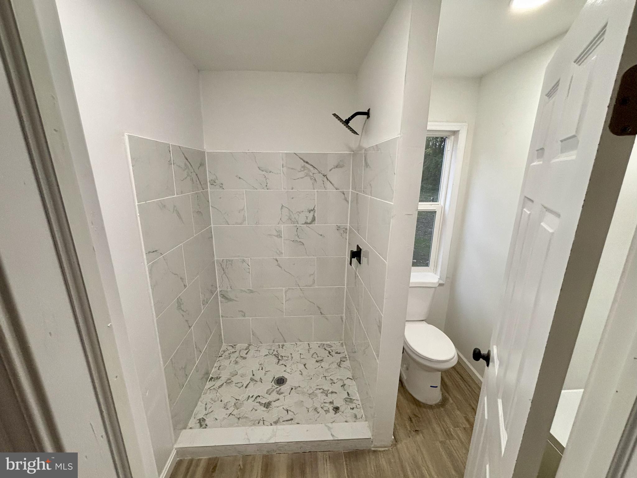 802 Fairmount Avenue Cambridge, MD 21613 - Photo 7 of 16 a bathroom with a sink and a shower