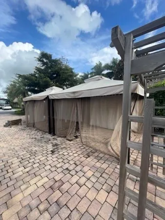 a backyard of a house with large trees