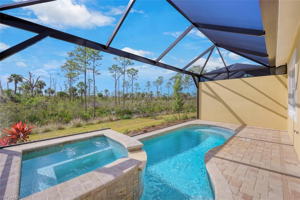 6435 Negril Isle Drive Naples, FL 34113 - Photo 1 of 35 a view of swimming pool from a balcony