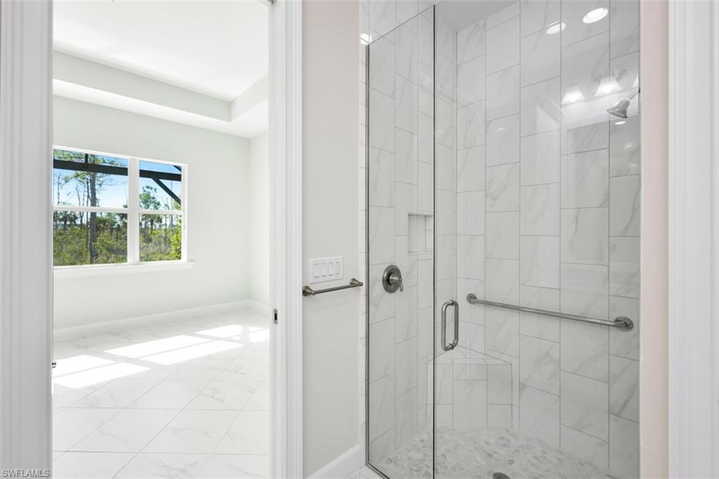 6435 Negril Isle Drive Naples, FL 34113 - Photo 22 of 35 a bathroom with a shower