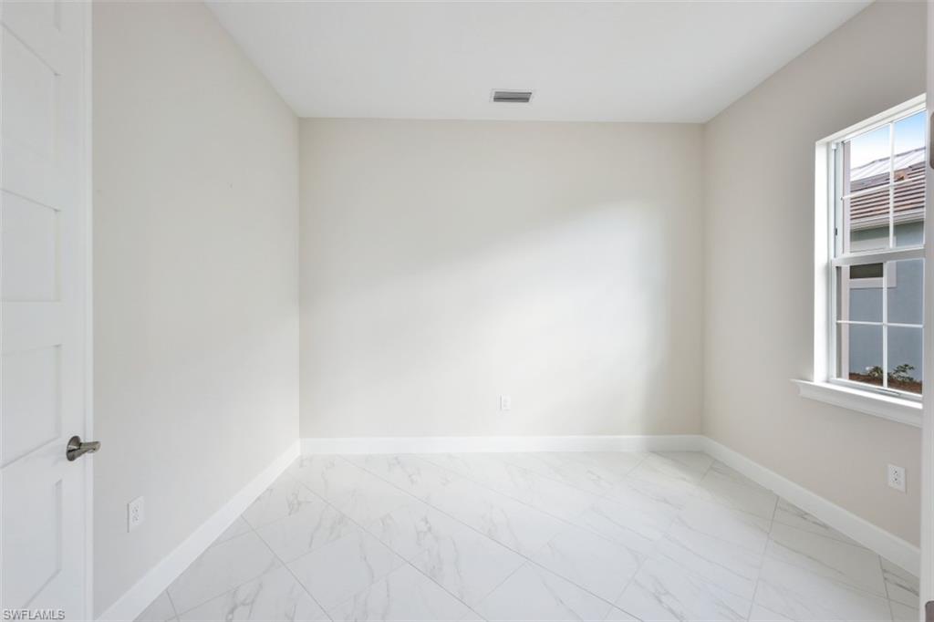 6435 Negril Isle Drive Naples, FL 34113 - Photo 25 of 35 a view of an empty room