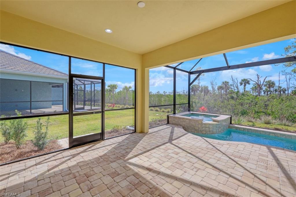 6435 Negril Isle Drive Naples, FL 34113 - Photo 27 of 35 a building outdoor space with seating space