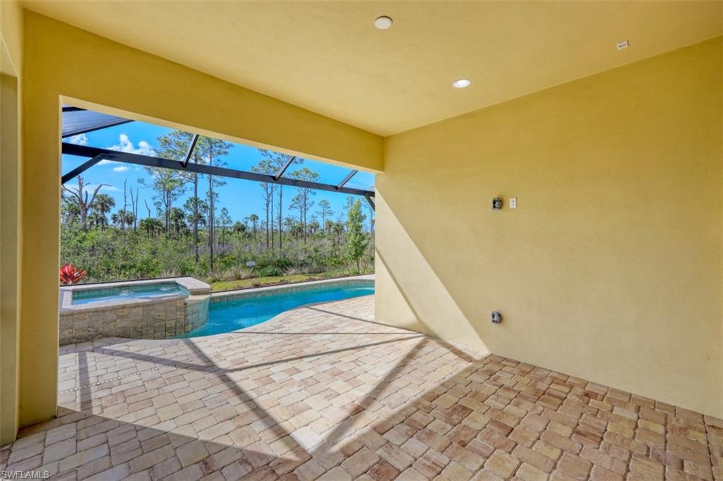 6435 Negril Isle Drive Naples, FL 34113 - Photo 28 of 35 a view of a big room with a bed