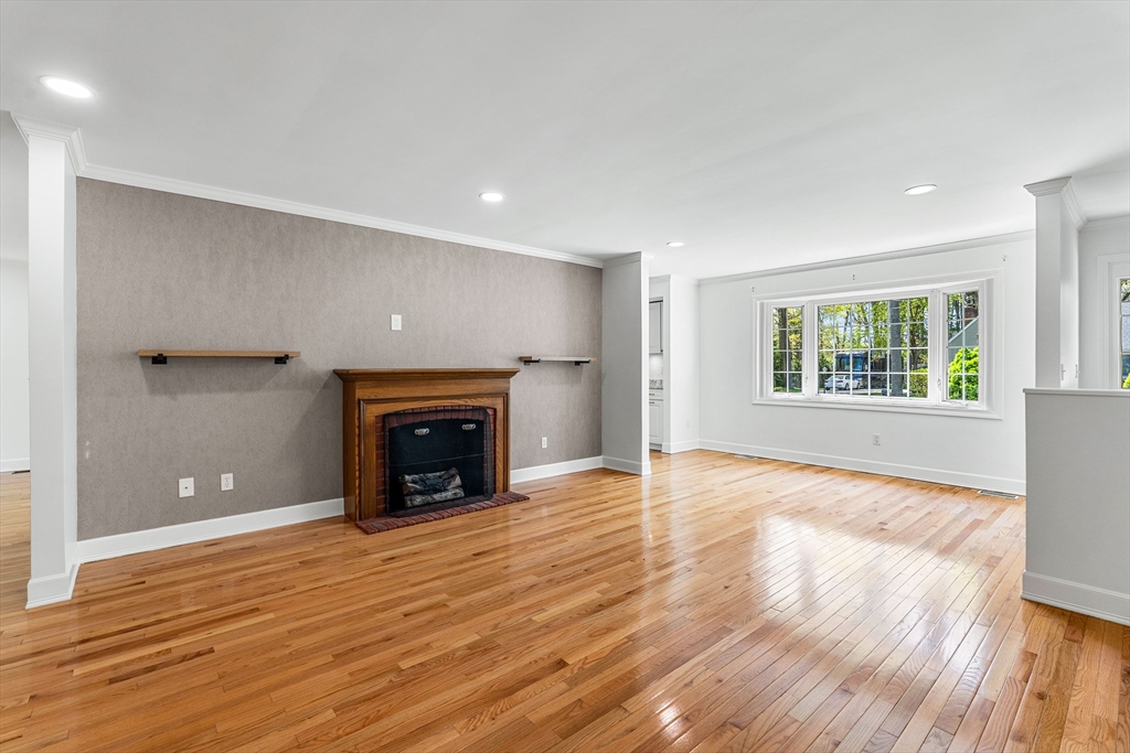 5 Marsden Court Seekonk, MA 02771 - Photo 3 of 39 wooden floor fireplace and windows in an empty room