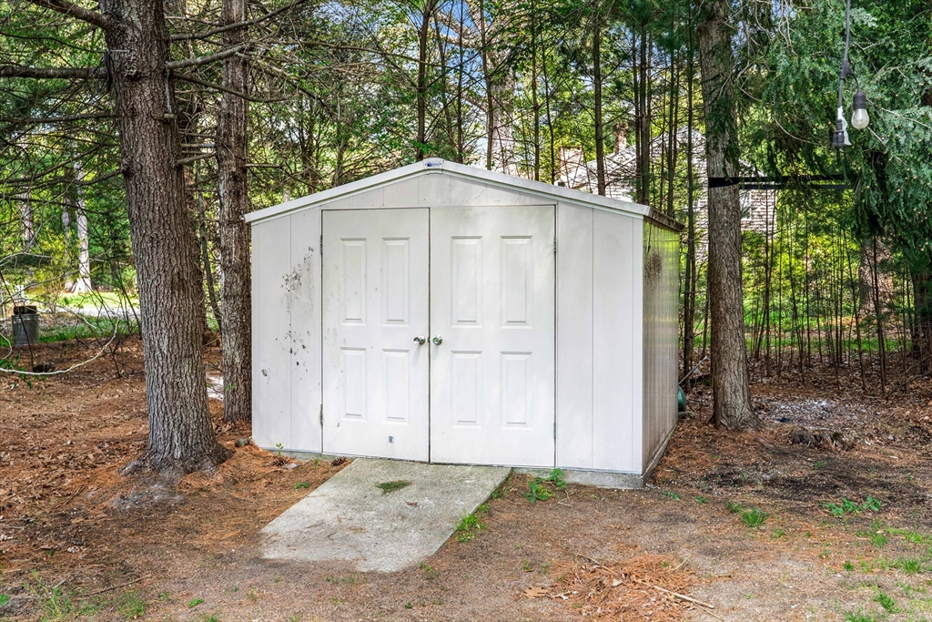 5 Marsden Court Seekonk, MA 02771 - Photo 34 of 39 a backyard of a house with large trees and wooden fence