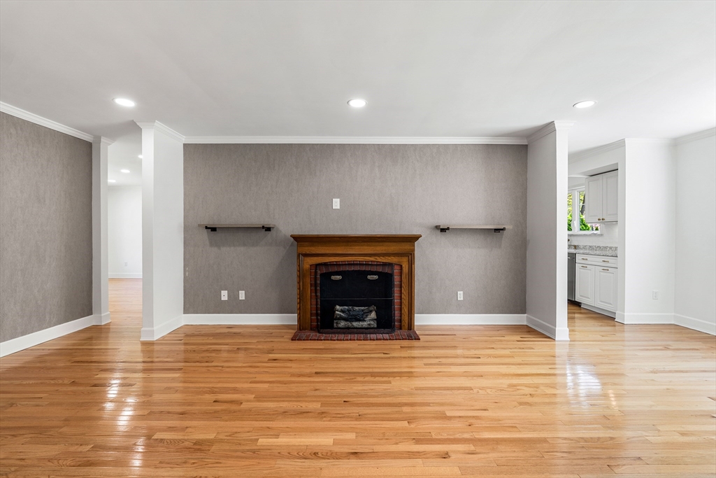 5 Marsden Court Seekonk, MA 02771 - Photo 4 of 39 a view of an empty room with wooden floor and a fireplace