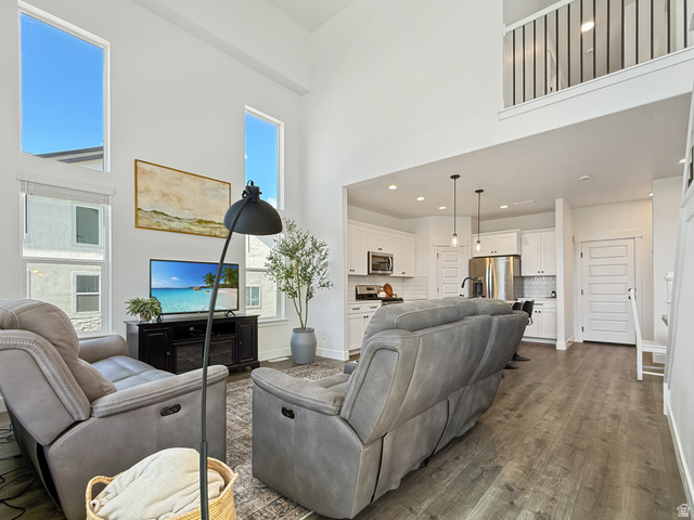641 Desert Willow Drive Mapleton, UT 84664 - Photo 5 of 41 Living area featuring a high ceiling and dark wood finished floors