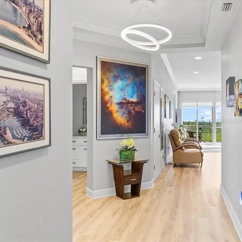 a living room with furniture and a painting