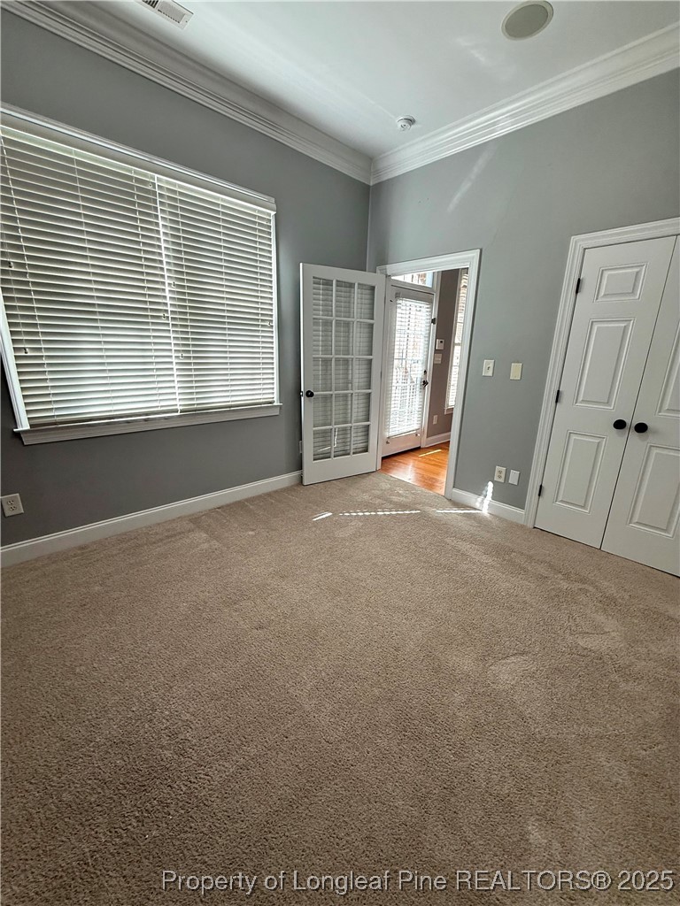 2661 Lockwood Road, Unit 103 Fayetteville, NC 28303 - Photo 20 of 26 a view of empty room with wooden floor and fan