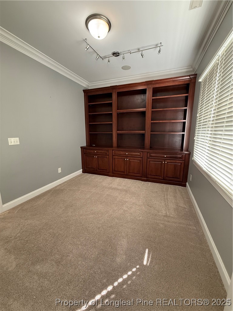 2661 Lockwood Road, Unit 103 Fayetteville, NC 28303 - Photo 24 of 26 a view of an empty room with furniture and a window