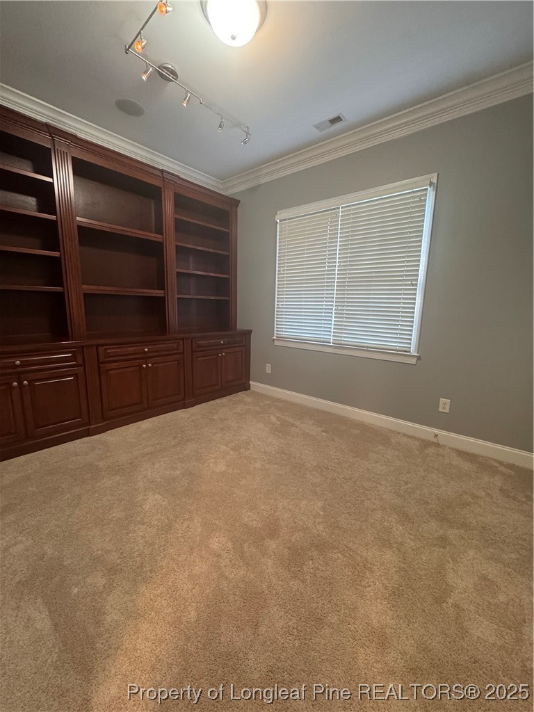 2661 Lockwood Road, Unit 103 Fayetteville, NC 28303 - Photo 25 of 26 a view of an empty room with a dresser and a window