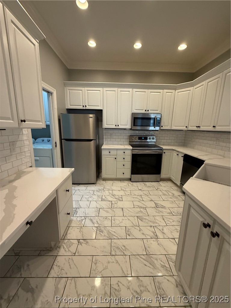 2661 Lockwood Road, Unit 103 Fayetteville, NC 28303 - Photo 4 of 26 a kitchen with a sink a refrigerator and cabinets