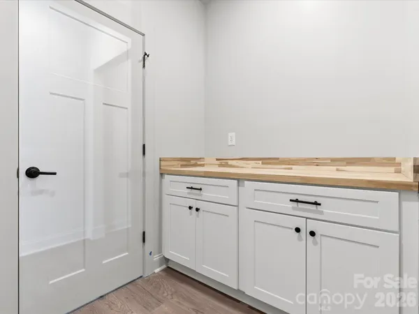 a view of a closet area with cabinets