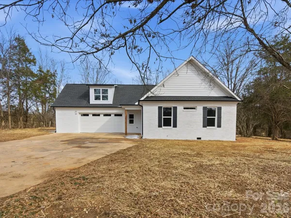 a house with trees in the background