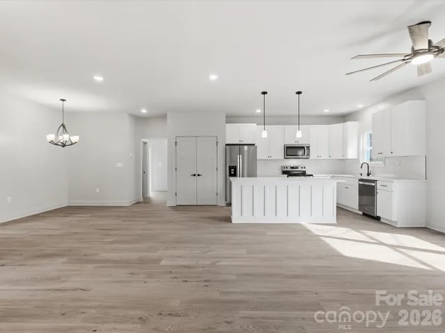 a view of kitchen with wooden floor