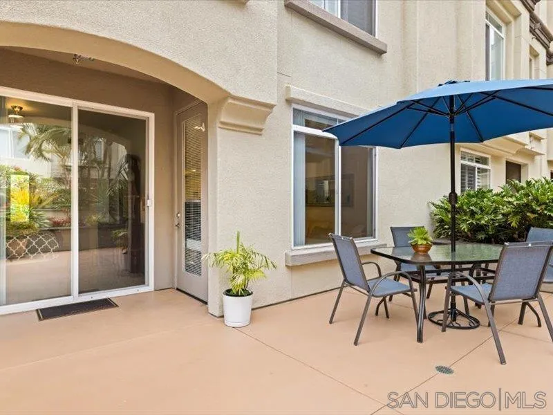 9237 Regents Road, Unit K101 La Jolla, CA 92037 - Photo 2 of 29 a patio with a patio table and chairs