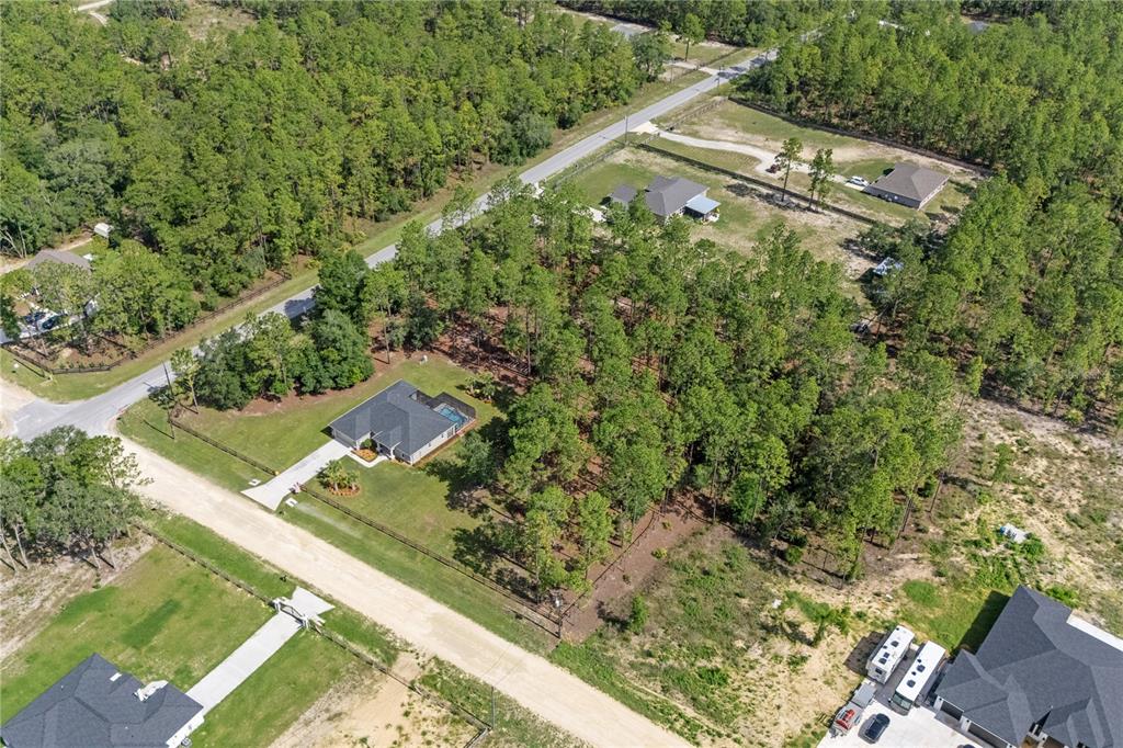 12929 Southwest 89th Street Dunnellon, FL 34432 - Photo 68 of 76 an aerial view of a house with a yard and lake view
