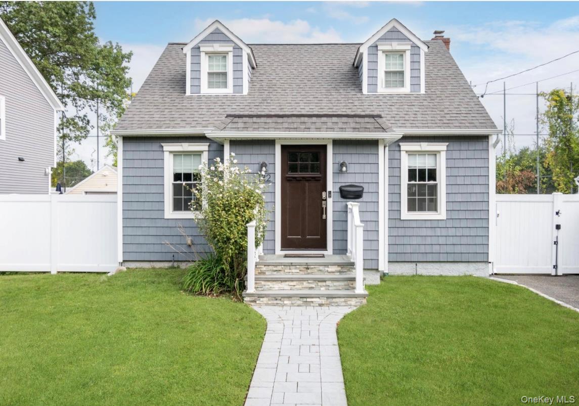 132 Webster Street Merrick, NY 11566 - Photo 1 of 28 a front view of a house with garden