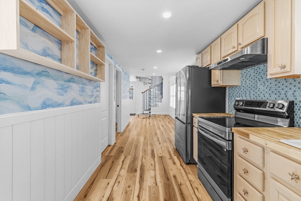 8 Cottage Street Wareham, MA 02571 - Photo 7 of 30 a view of a kitchen with wooden floor and cabinets