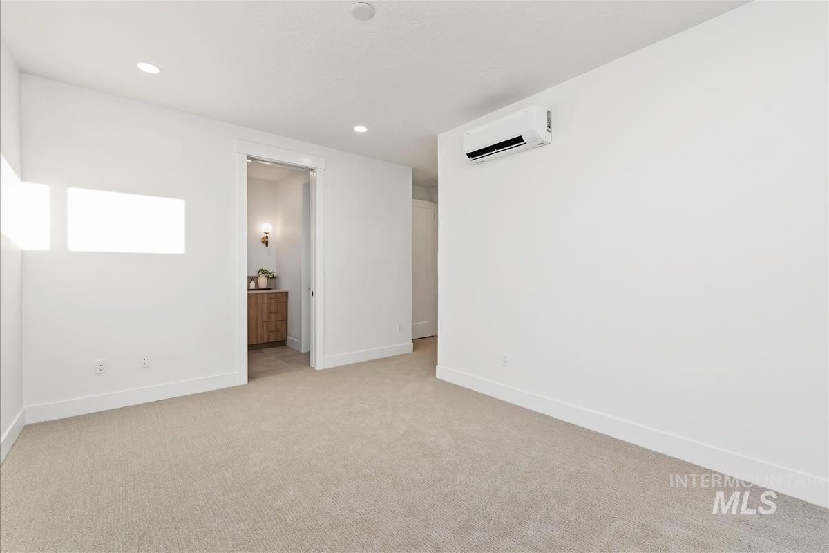 3219 West Moore Street Boise, ID 83702 - Photo 28 of 36 Spacious room featuring neutral carpeting and white baseboards