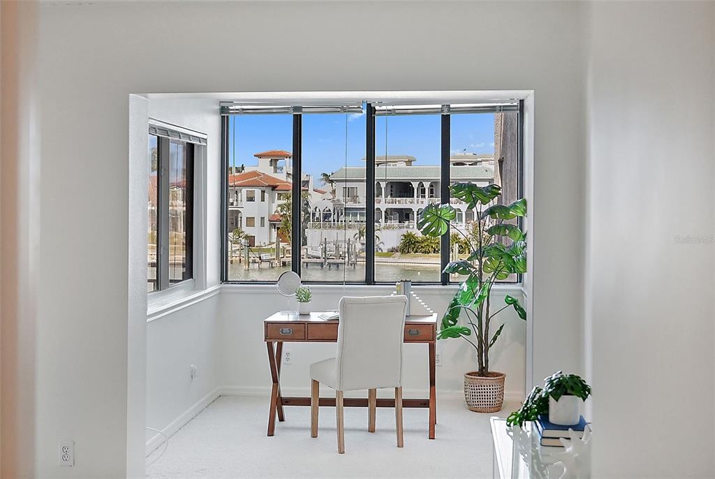 936 Pinellas Bayway South, Unit T5 Tierra Verde, FL 33715 - Photo 17 of 38 a view of a dining room with furniture window and outside view