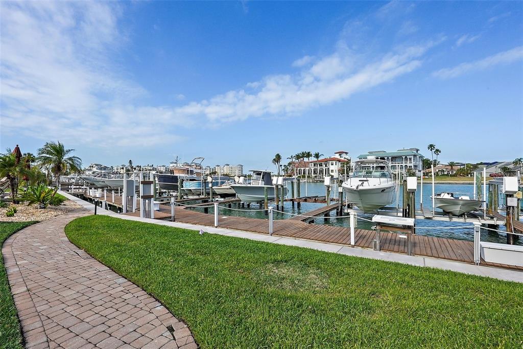 936 Pinellas Bayway South, Unit T5 Tierra Verde, FL 33715 - Photo 26 of 38 a view of a chairs and table in the garden