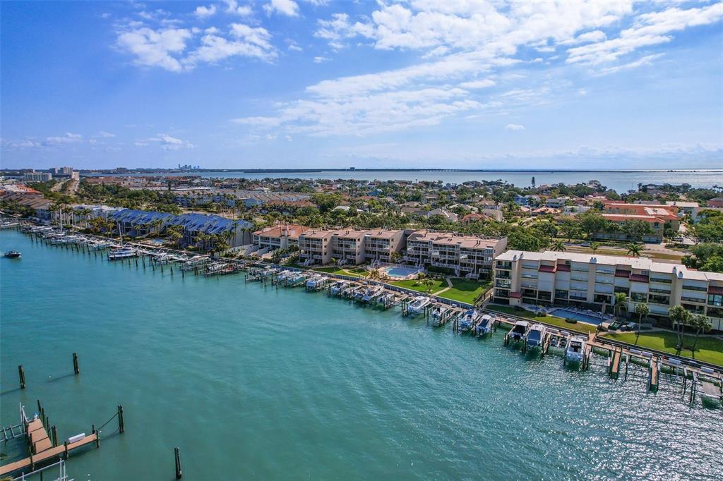 936 Pinellas Bayway South, Unit T5 Tierra Verde, FL 33715 - Photo 29 of 38 an aerial view of a city with lots of residential buildings lake and ocean view