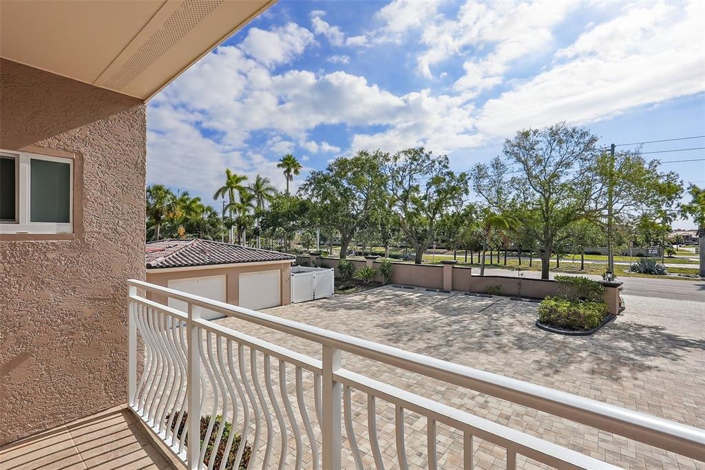 936 Pinellas Bayway South, Unit T5 Tierra Verde, FL 33715 - Photo 36 of 38 a view of a roof deck with two couches and wooden floor