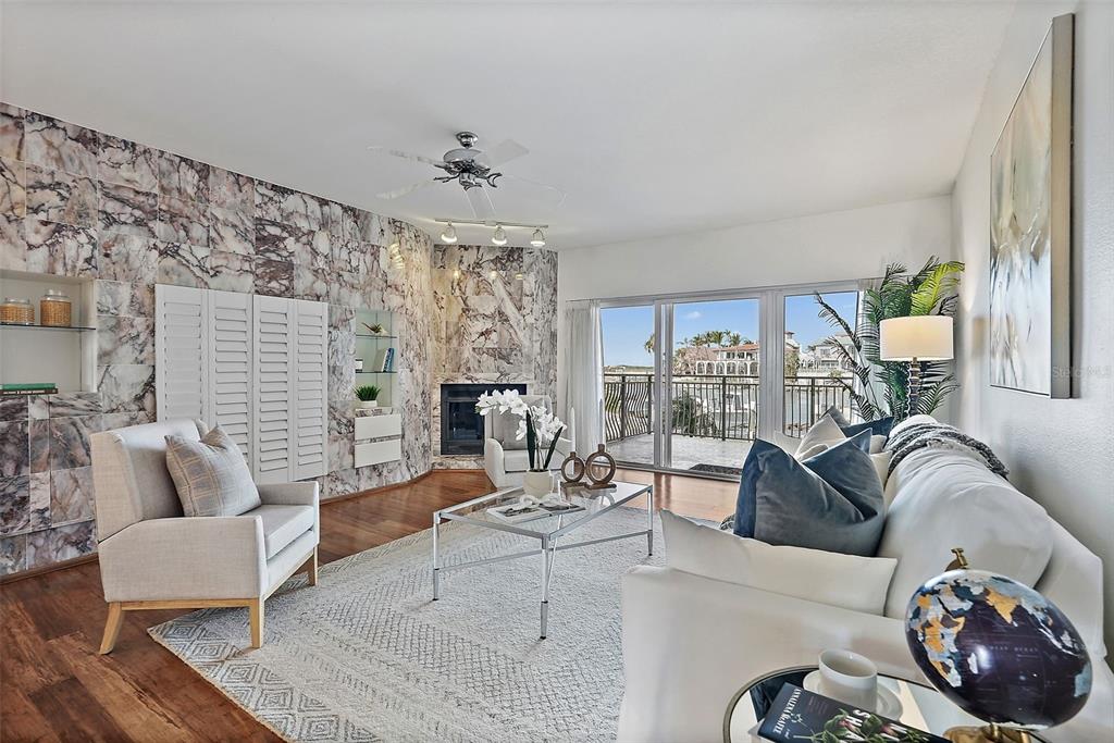 936 Pinellas Bayway South, Unit T5 Tierra Verde, FL 33715 - Photo 5 of 38 a living room with furniture and a large window