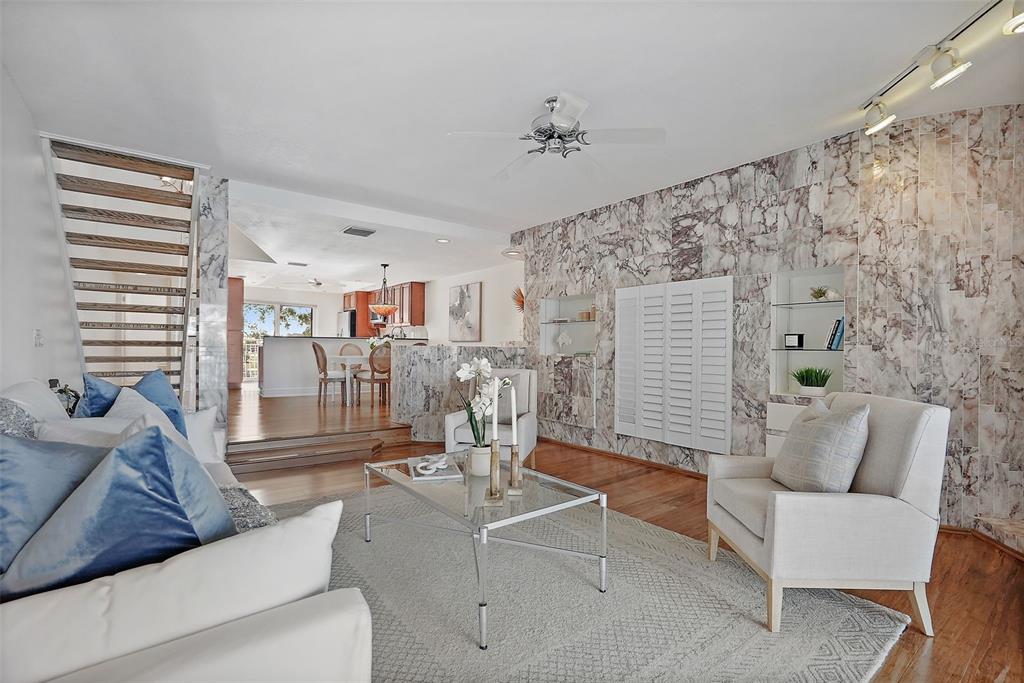 936 Pinellas Bayway South, Unit T5 Tierra Verde, FL 33715 - Photo 6 of 38 a living room with furniture and wooden floor