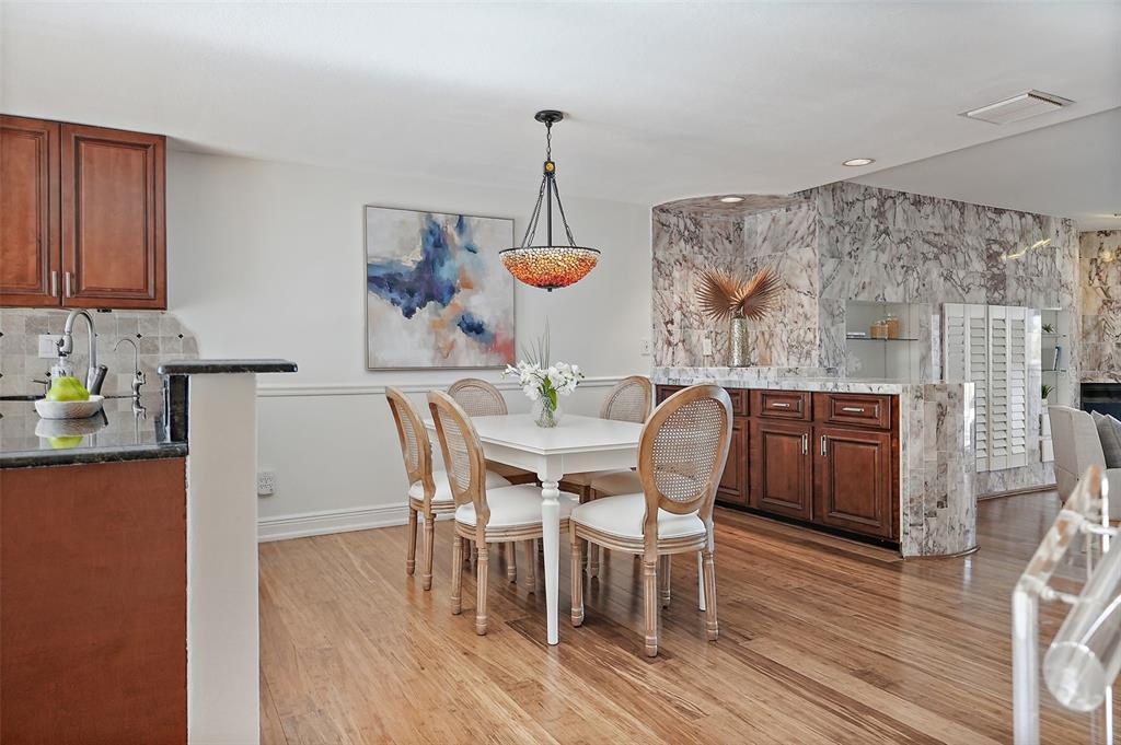 936 Pinellas Bayway South, Unit T5 Tierra Verde, FL 33715 - Photo 9 of 38 a dining room with furniture window and wooden floor