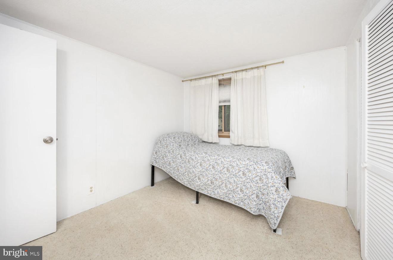 5 Falcon Bridge Road Ocean Pines, MD 21811 - Photo 29 of 59 a bedroom with a bed and a window