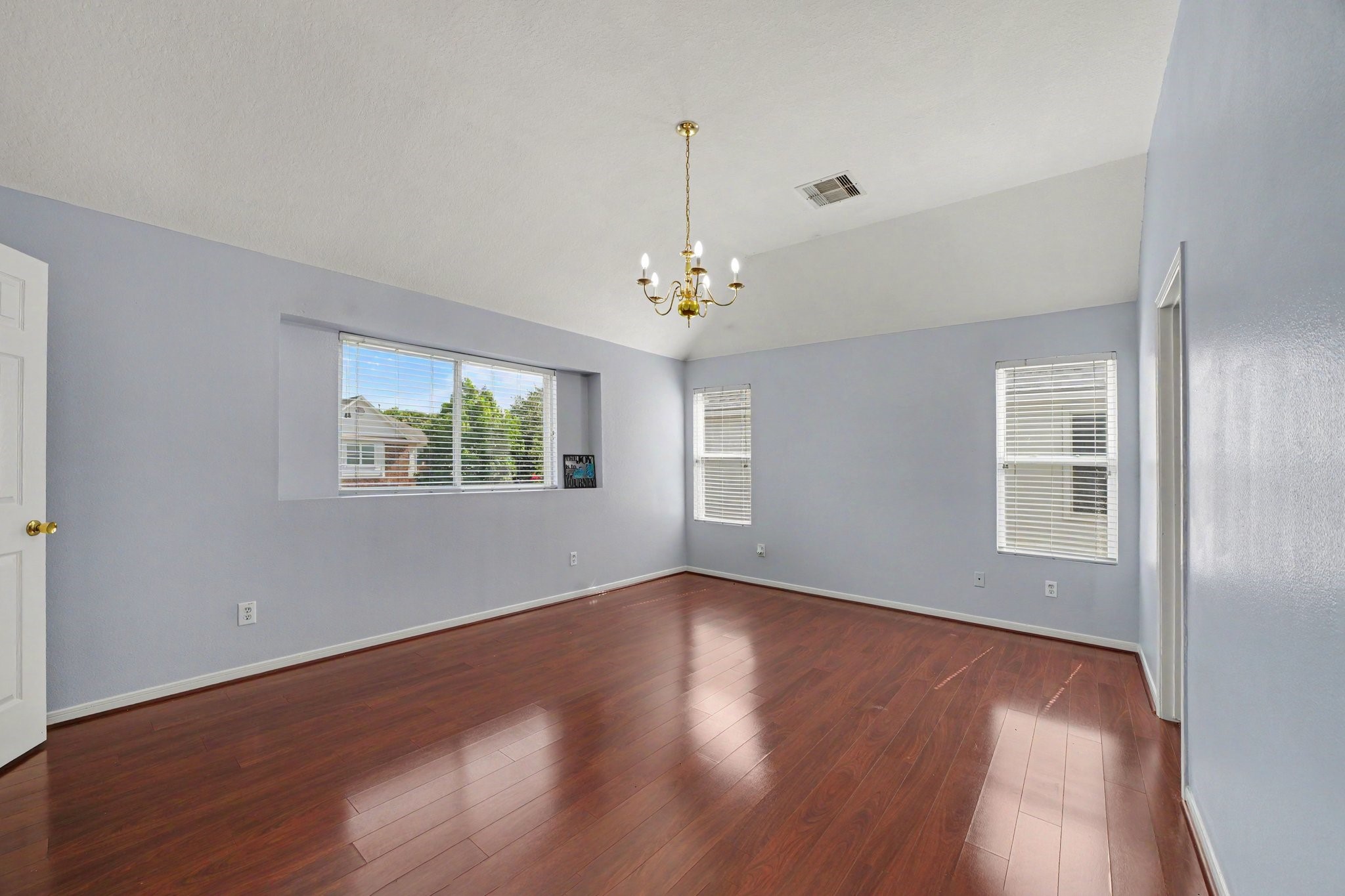 5622 Wasabi Lane Baytown, TX 77521 - Photo 14 of 29 wooden floor in an empty room with a window