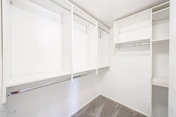 a view of an empty walk in closet