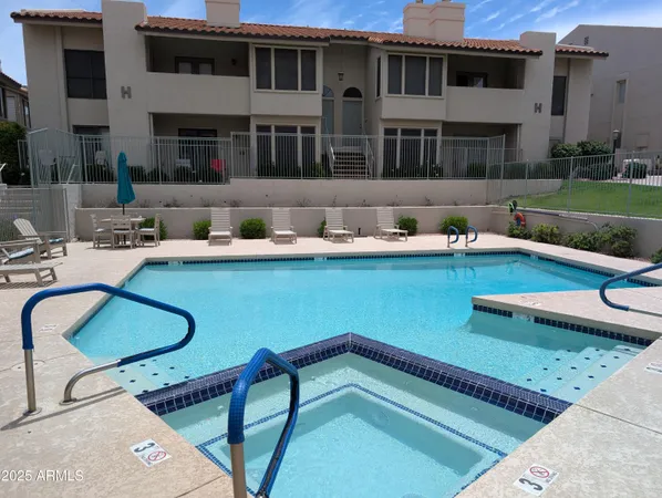 a backyard of a house with seating space