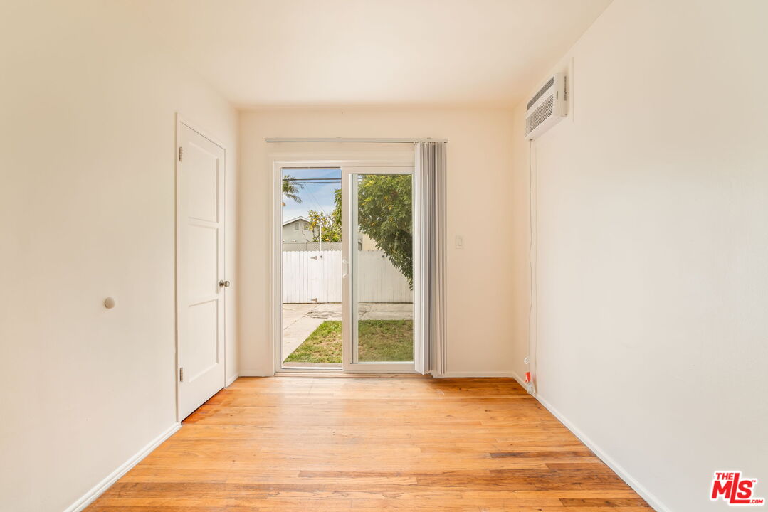 4332 Alla Road Los Angeles, CA 90066 - Photo 11 of 25 a view of an empty room with wooden floor and a window