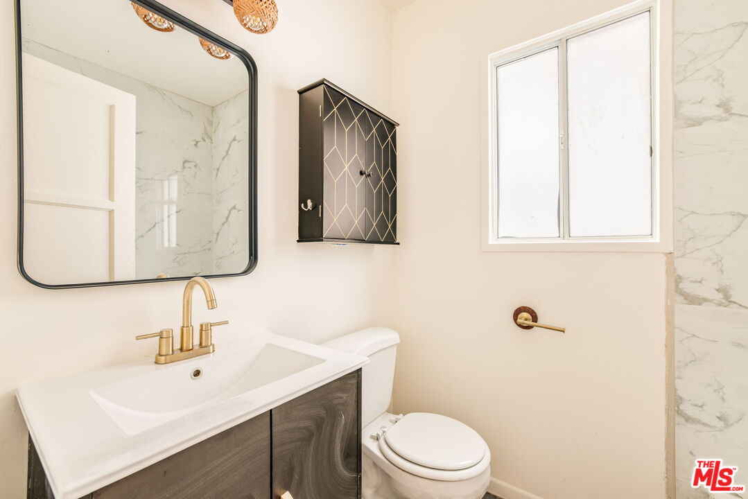 4332 Alla Road Los Angeles, CA 90066 - Photo 14 of 25 a bathroom with a sink vanity mirror and toilet