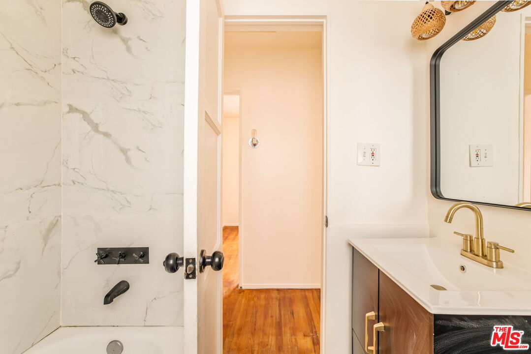 4332 Alla Road Los Angeles, CA 90066 - Photo 15 of 25 a bathroom with a sink and a mirror